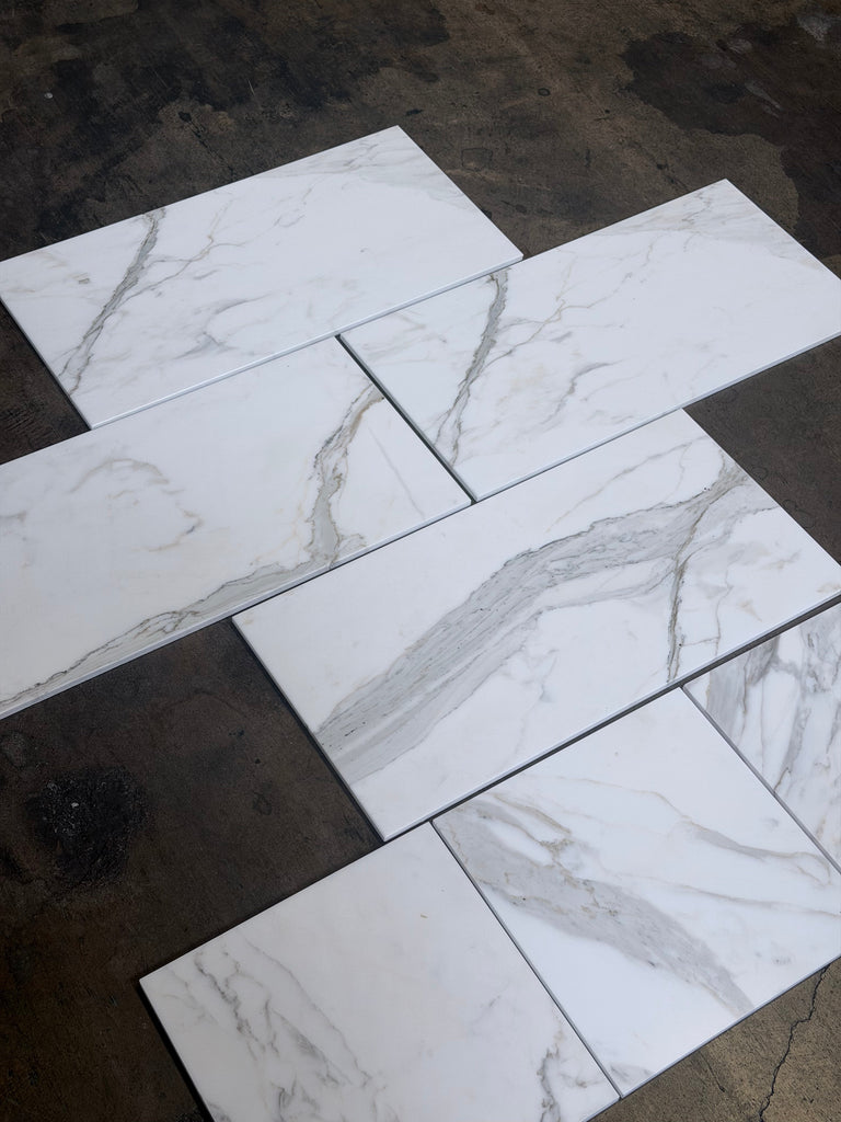 Calacatta Gold marble 12x12 polished tiles with white base and gray veining