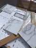 Calacatta Gold Marble 12x12 polished tiles in white marble with gray veining, foam wrapped