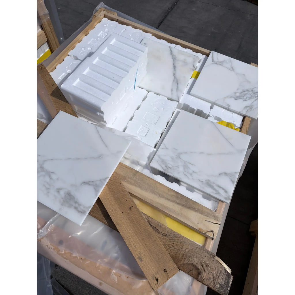 Calacatta Gold Marble 12x12 Polished white tiles with gray veining in crate