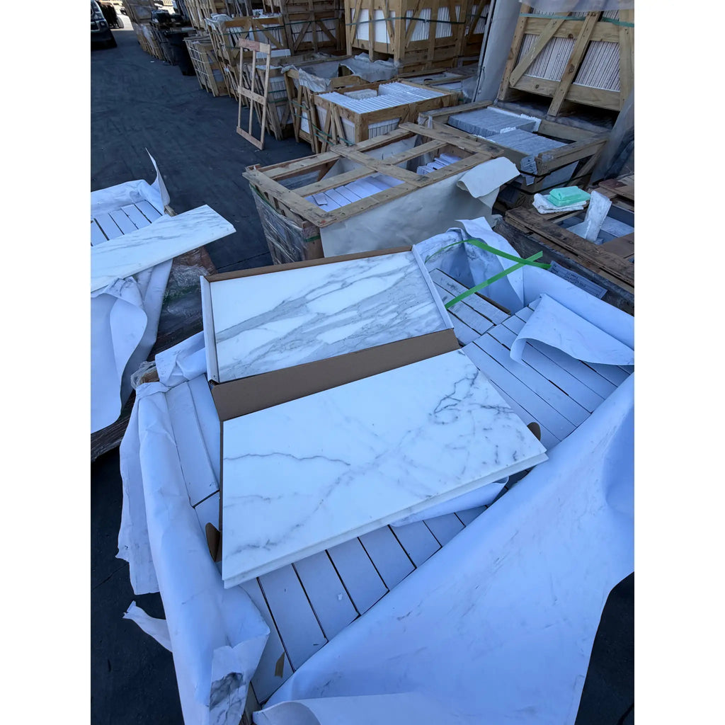 Calacatta Gold Marble 12x24 Polished Panels Stacked on Pallets