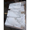 Calacatta Gold Marble 12x24 polished tiles with white marble-effect and gray veining in plastic wrap
