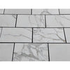 White marble-patterned tiles from Calacatta Gold Marble 12x24 polished or honed collection