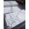 Calacatta gold marble 12x24 polished white slabs with elegant gray veining showcasing a natural stone finish