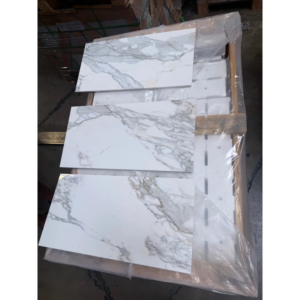 Calacatta Gold Marble 12X24 white tiles with gray veining in protective plastic