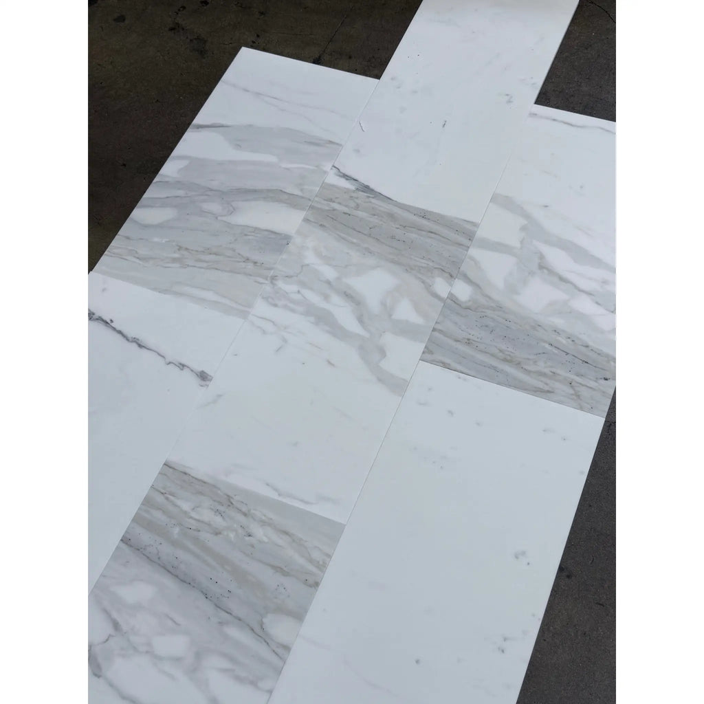 Marble-effect white and gray porcelain tiles from Calacatta Gold Marble 12x24 collection