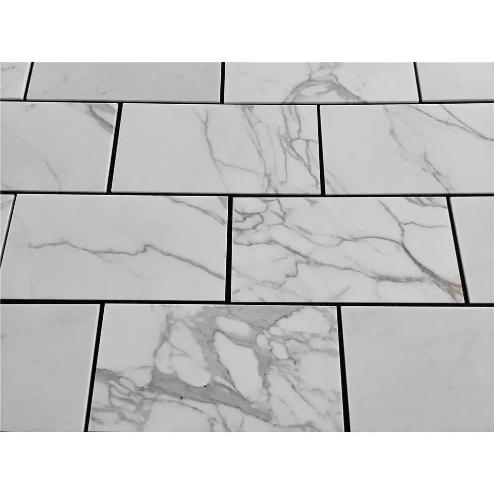 White marble-patterned tiles from Calacatta Gold Marble 12x24 polished or honed collection
