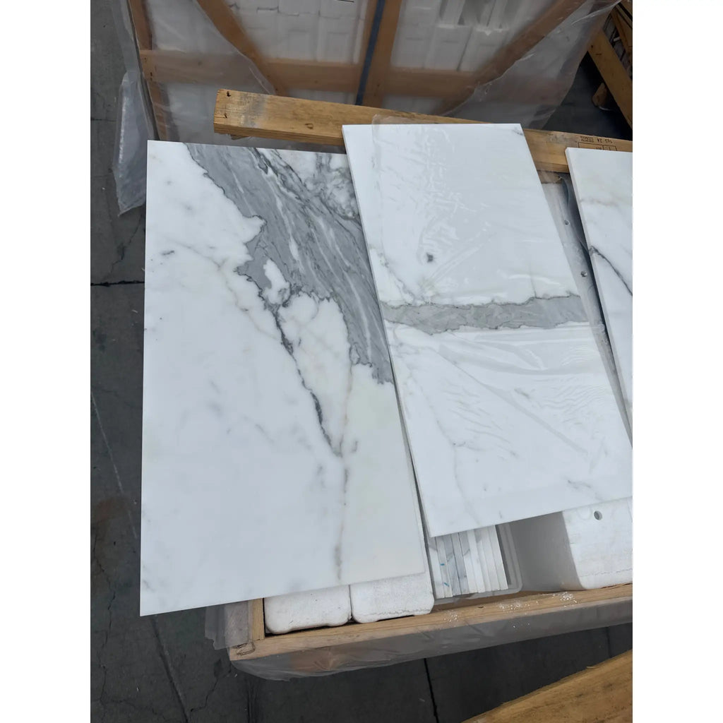 Calacatta Gold Marble 12x24 slabs with white background and elegant gray veining