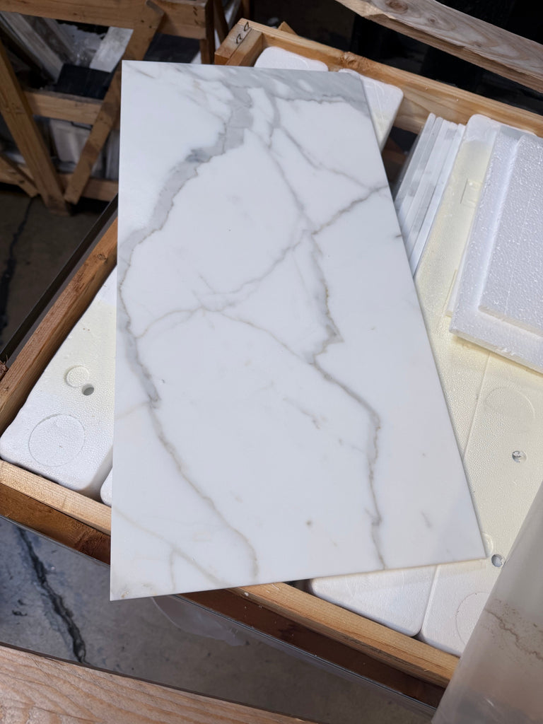 Calacatta Gold Marble 12x24 Polished Ceramic Tile with Gray Veining