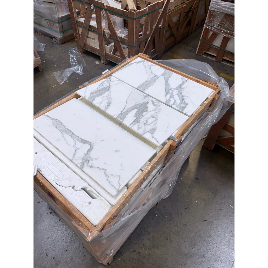 White Calacatta Gold Marble tiles with gray veining in a wooden crate for 12x24 polished or honed finish