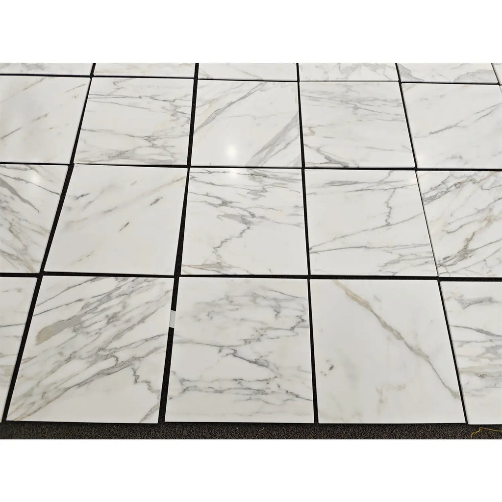 Calacatta gold marble 18x18 polished floor tiles in white marble effect with subtle gray veining