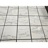 White marble Calacatta Gold 18x18 tiles with elegant gray veining arranged in a polished or honed grid pattern
