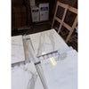 Calacatta Gold Marble 18x18 polished tiles stacked on warehouse floor