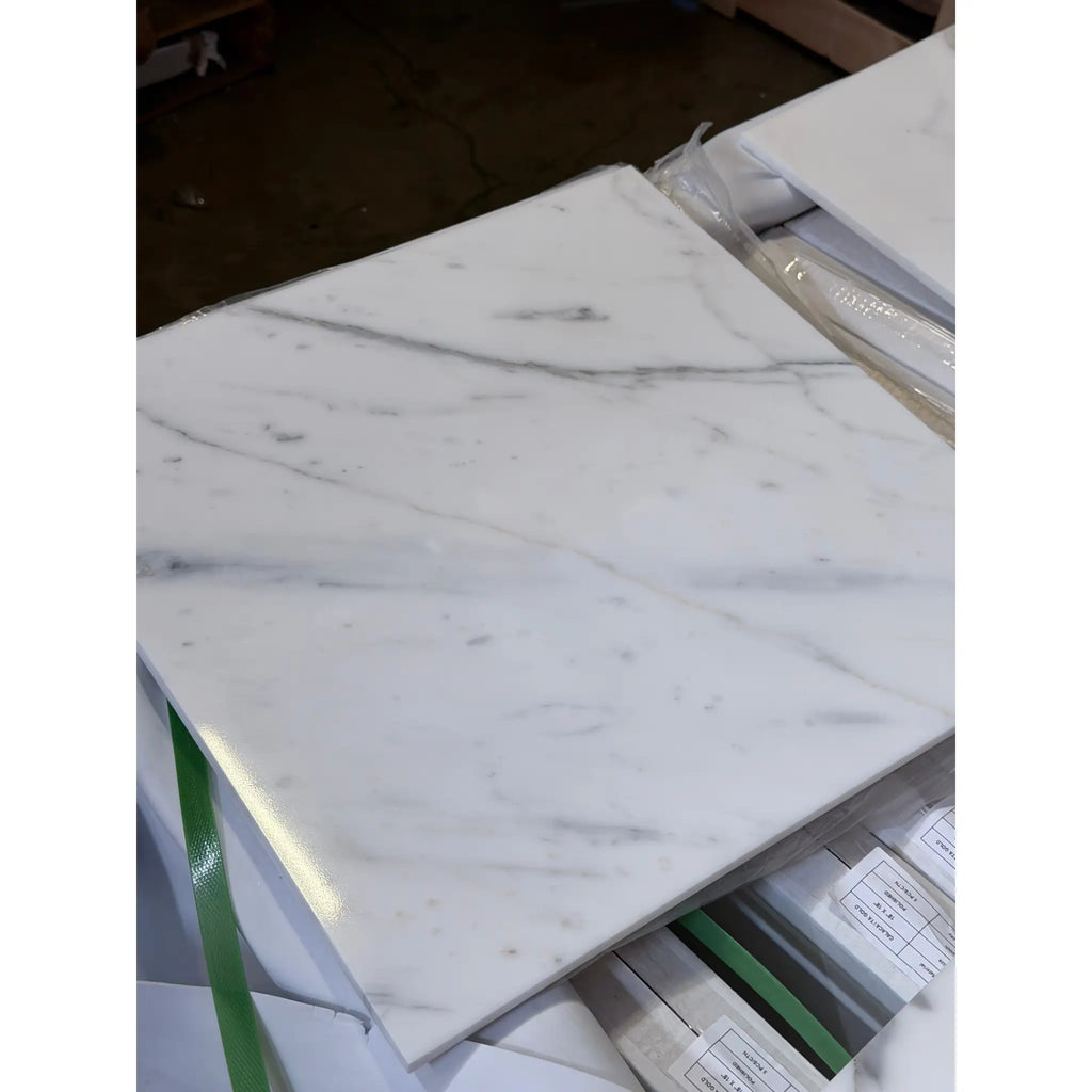 Calacatta Gold Marble 18x18 polished tile with white base and subtle gray veining