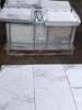 Calacatta Gold Marble 18x18 Polished white tiles with gray veining in boxes on pallet