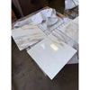 Calacatta Gold Marble 18x18 polished tiles with golden veining, stacked