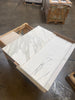 Two rectangular Calacatta Gold Marble tiles with gray veining in polished or honed finish