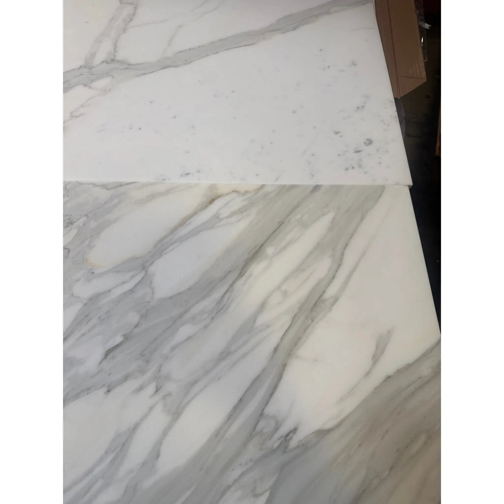 Two white Calacatta Gold marble slabs with gray veining for luxury flooring or countertops