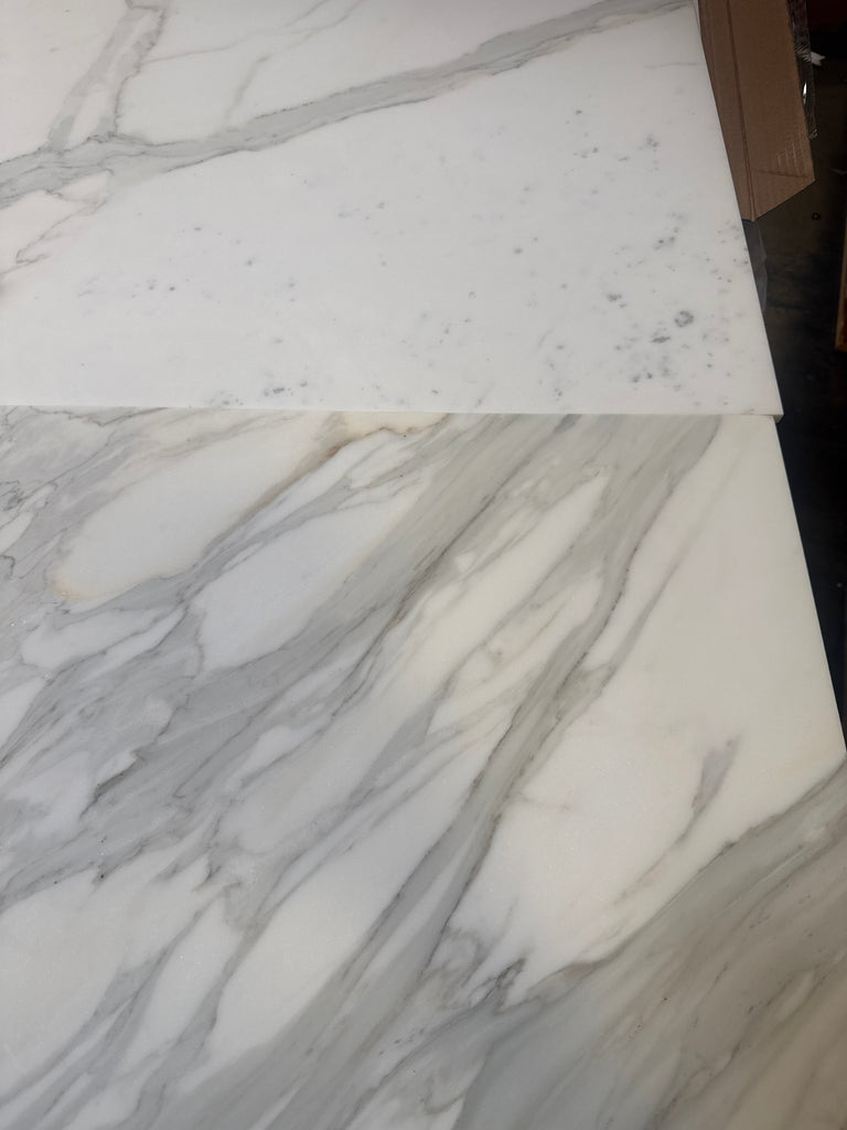 Two white Calacatta Gold marble slabs with gray veining for luxury flooring or countertops