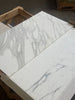 Calacatta Gold Marble 18X36 polished or honed with two white slabs featuring gray veining