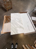 White marble-look porcelain tiles with grey veining from Calacatta Gold Marble collection