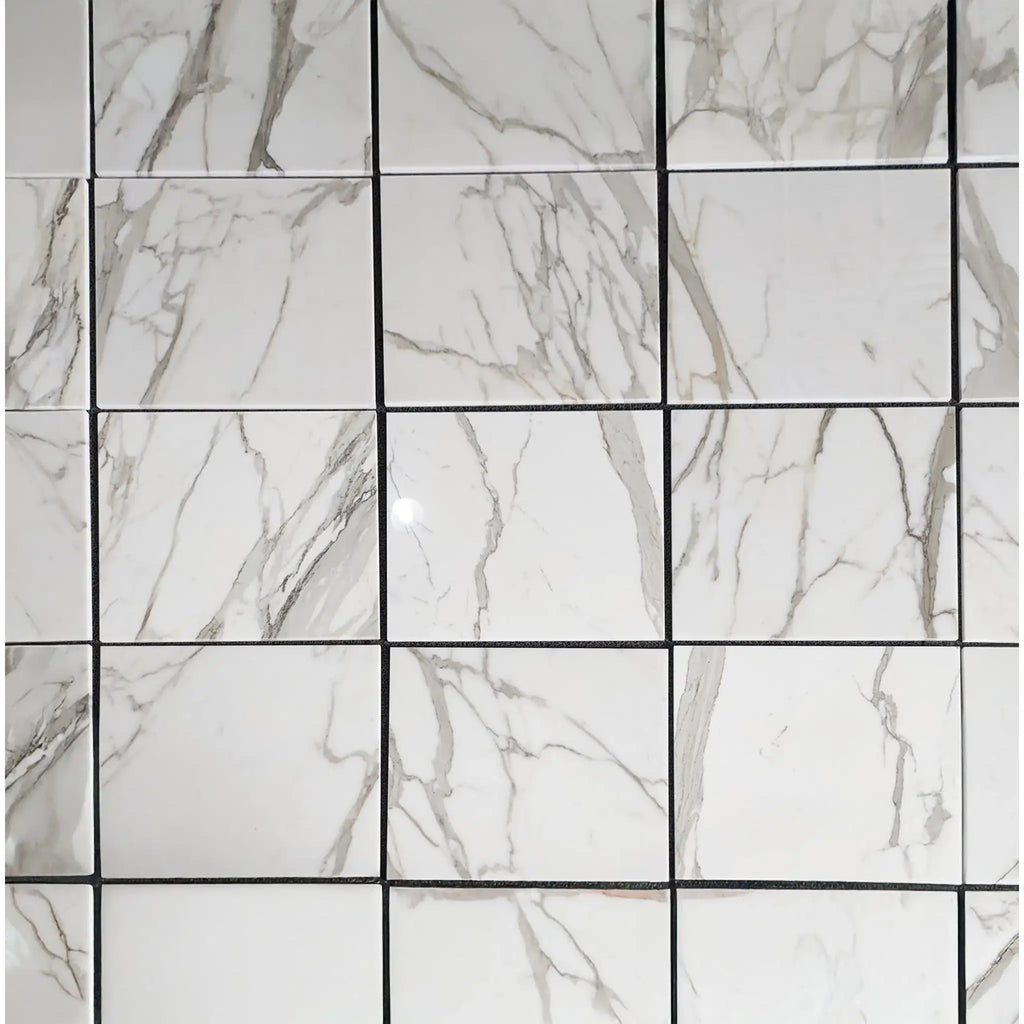 Calacatta Gold Marble 18X36 Polished or Honed in a white marble tile grid arrangement