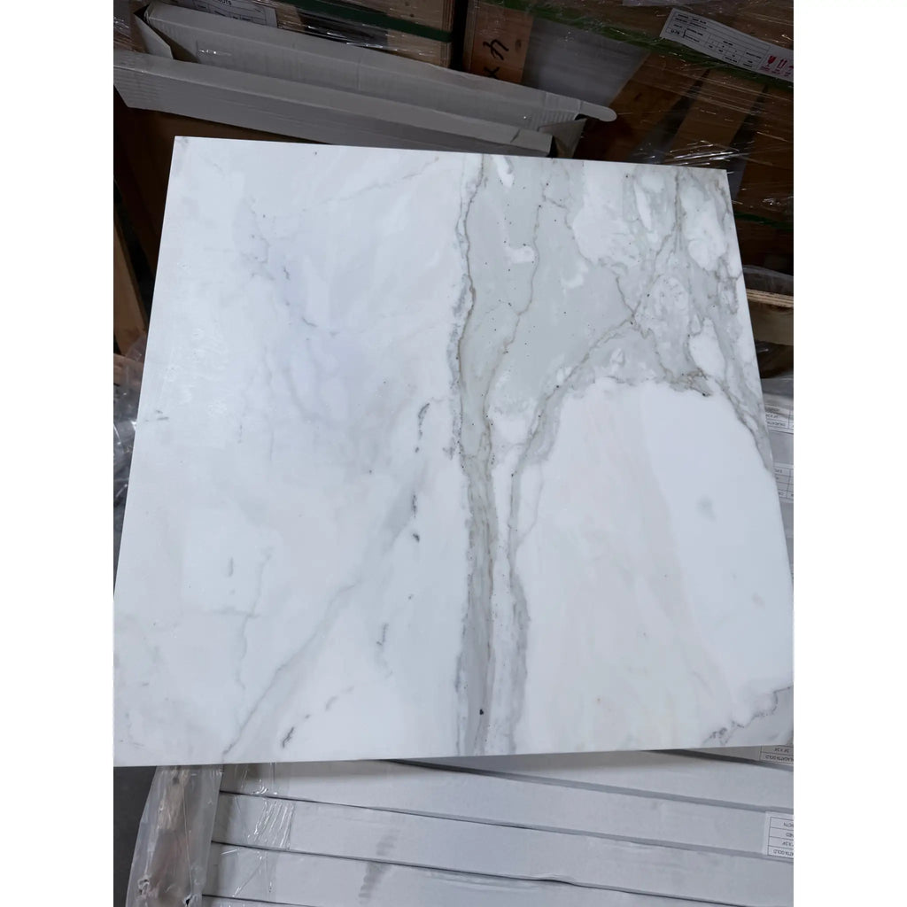 Square marble-patterned tile from Calacatta Gold Marble 24X24 collection in polished or honed finish