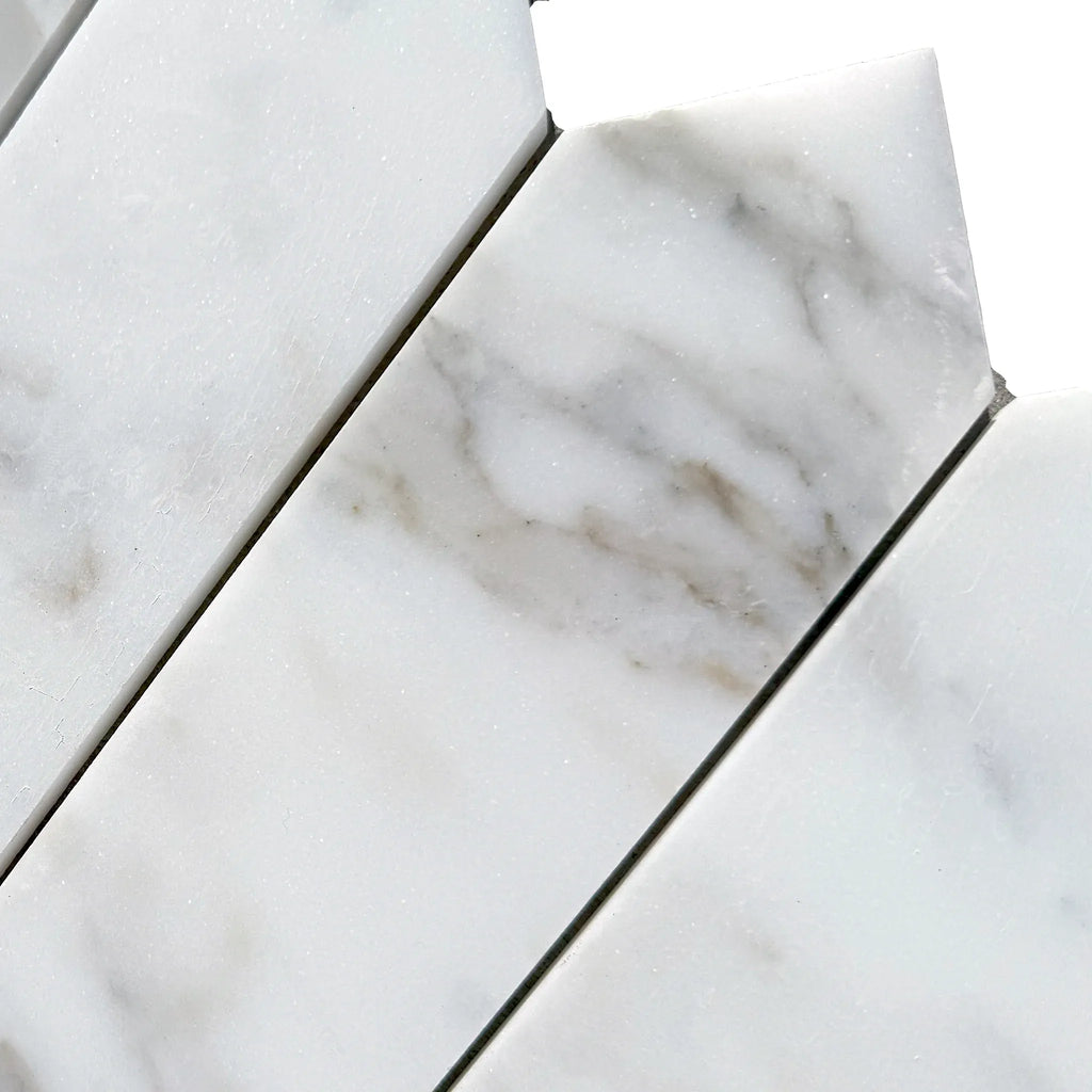 Calacatta Gold Marble 3 X 12 Picket Mosaic featuring white marble mosaic tiles