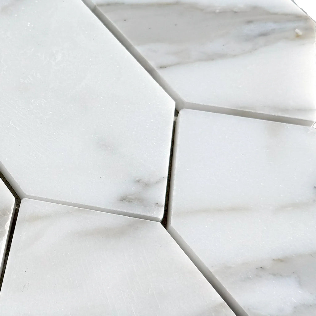 White marble hexagon tiles in Calacatta Gold Marble 3’’ X 12’’ Picket Mosaic design