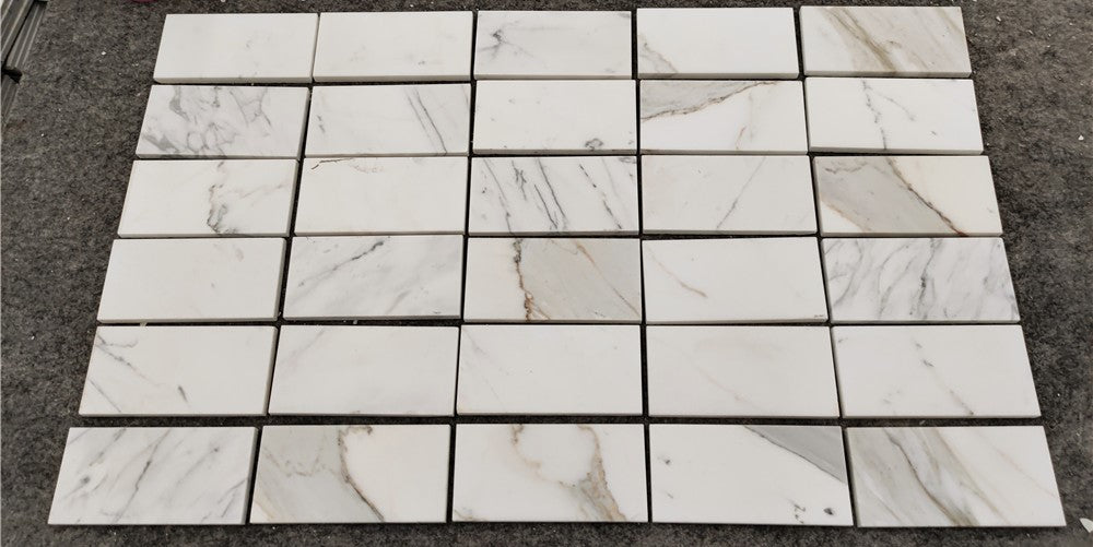 Calacatta Gold 3x6 polished white marble mosaic tiles with gray veining