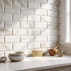 Calacatta Gold Marble 4x12 deep-beveled polished-honed white subway tiles with elegant gold veining