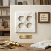 Calacatta gold marble double duplex switch wall plate in white marble with subtle veining and four circular cutouts