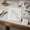 Calacatta Gold marble double toggle plate switch wall plate in white marble with subtle veining and two toggle switches