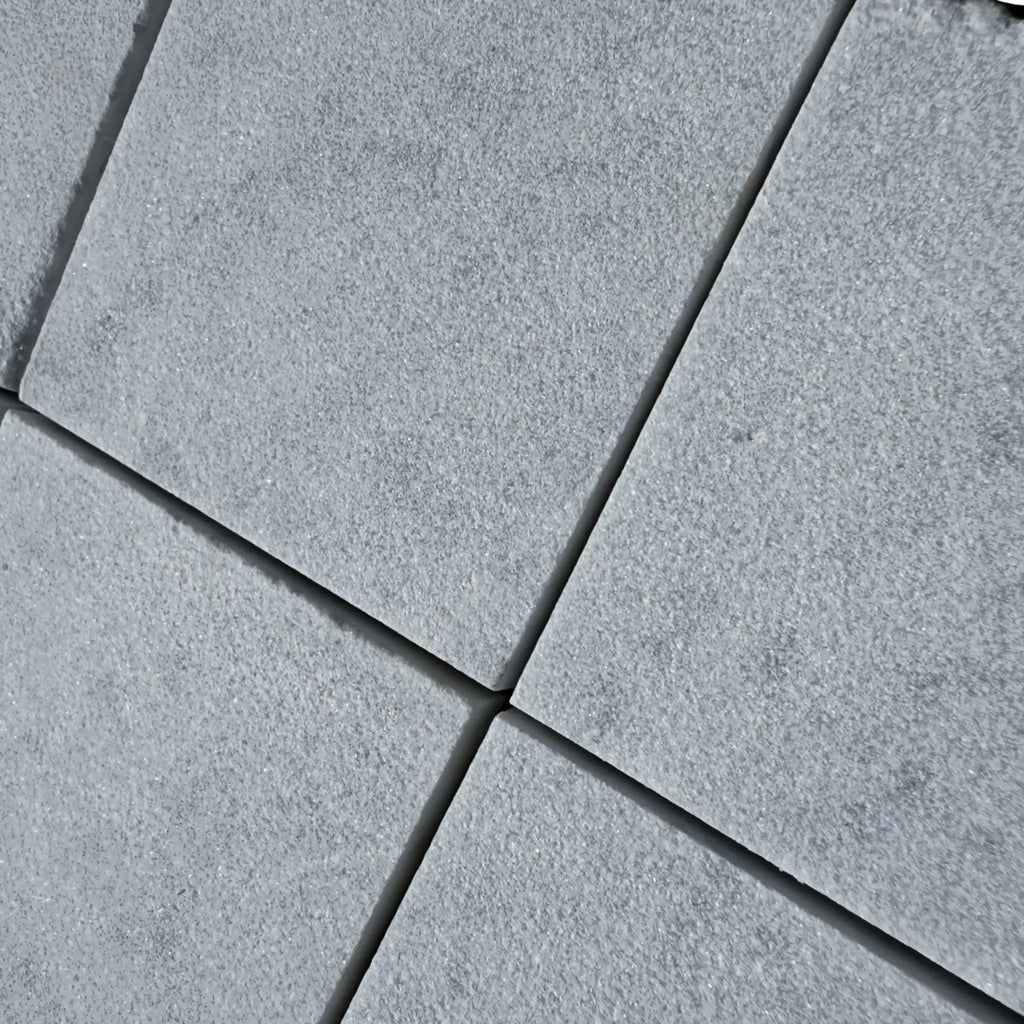 Gray stone pavers from Calacatta Gold Marble collection in a sand blasted finish