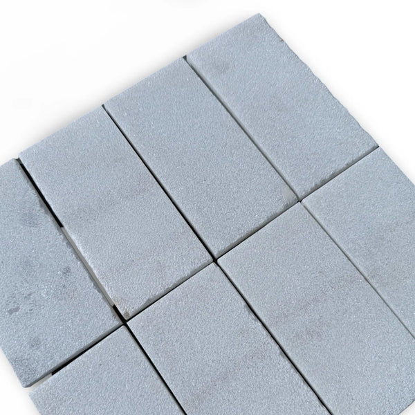 Rectangular gray paving stones from Calacatta Gold Marble in sand blasted finish