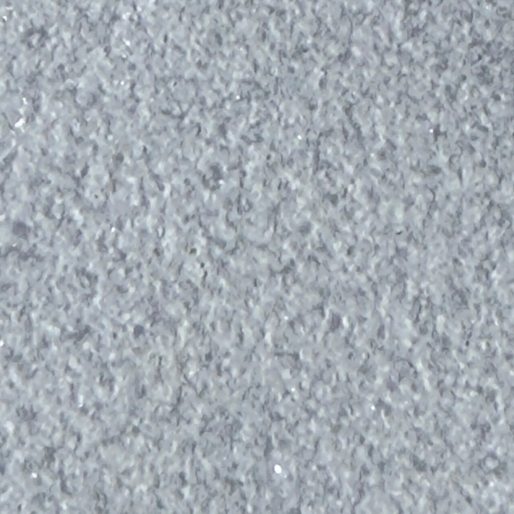 Rough gray speckled surface of Calacatta Gold Marble in Sand Blasted finish