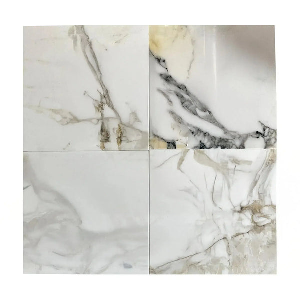 Four Calacatta Gold Medley polished marble tiles showcasing elegant marble patterns