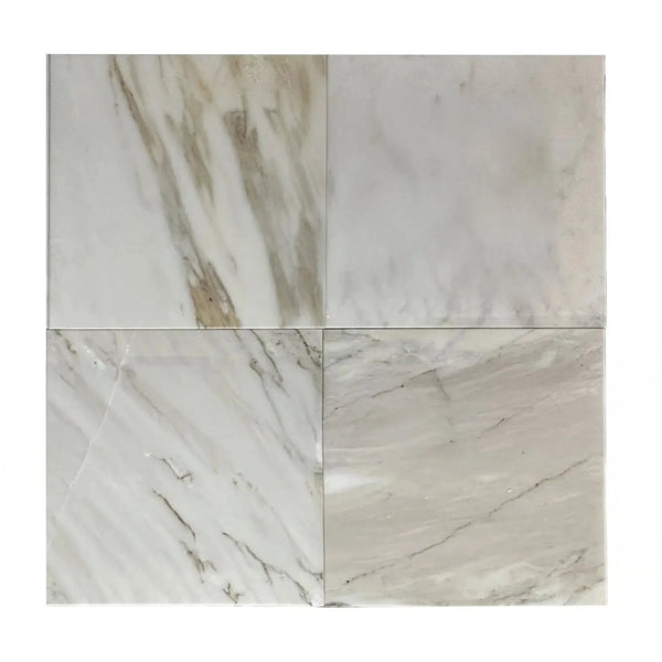 Four Calacatta Gold Medley 12X12 Polished Marble Tiles in a stylish display