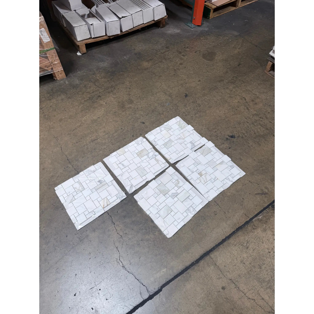 Six patterned Calacatta Gold Mini-Versailles Mosaic Marble Tiles for stylish flooring or walls