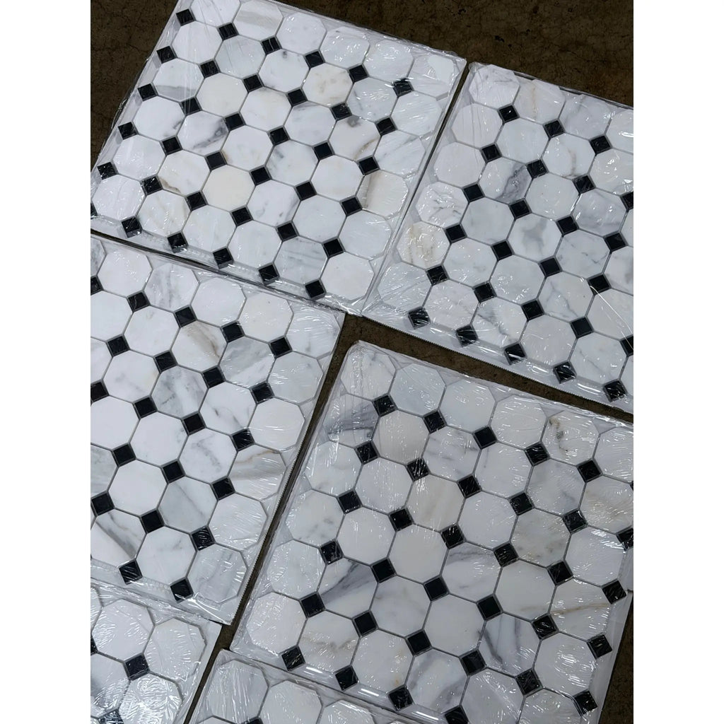 Calacatta gold octagon polished marble tile with white hexagonal tiles and black diamond accents packaged in clear plastic