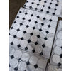 Calacatta gold octagon mosaic marble tile polished with white hexagonal tiles and black diamond accents wrapped in clear plastic