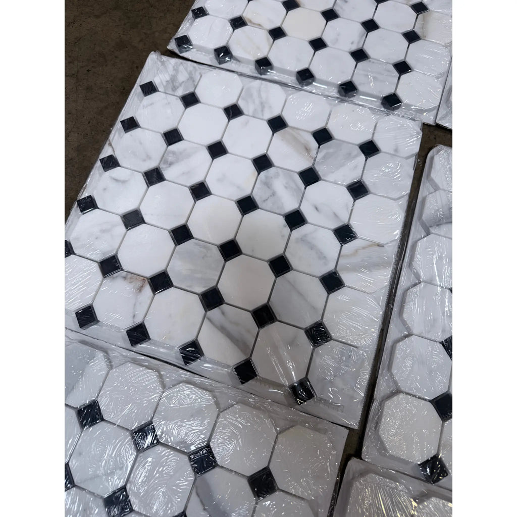 Calacatta gold octagon mosaic marble tile polished with white hexagonal tiles and black diamond accents wrapped in clear plastic