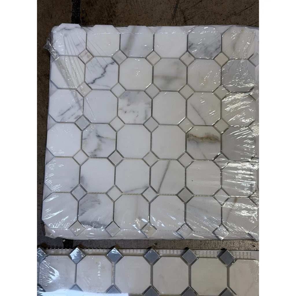 Calacatta Gold octagon mosaic marble tile with blue-gray accents and silver grout