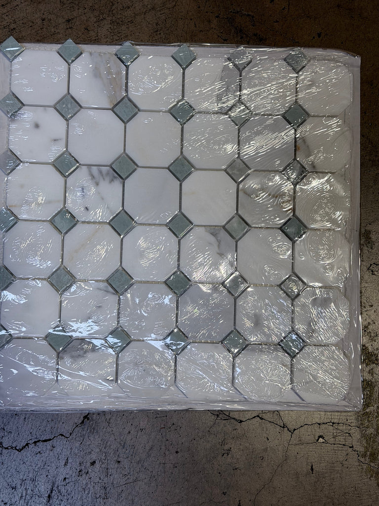 Calacatta Gold Octagon mosaic marble tile panel in white marble and gray mirrored tiles, wrapped in clear plastic