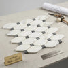 White hexagonal polished calacatta gold octave marble mosaic tile with gray blue-gray accents in honeycomb pattern