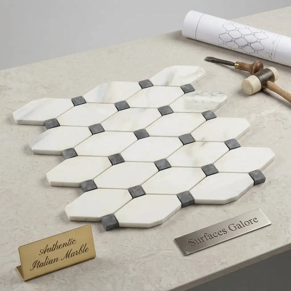 White hexagonal polished calacatta gold octave marble mosaic tile with gray blue-gray accents in honeycomb pattern
