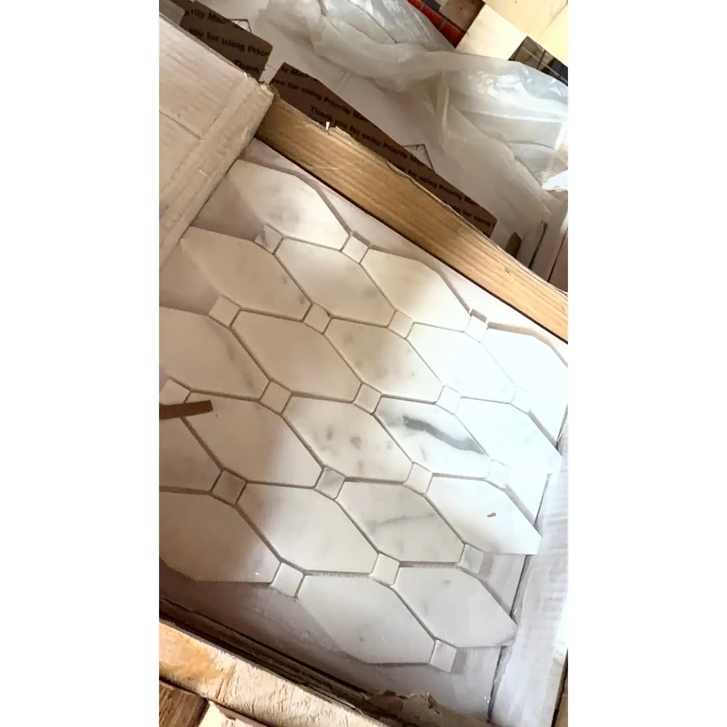 White marble mosaic tile with geometric hexagonal pattern and subtle gray veining calacatta gold octave polished or honed