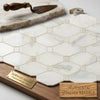 White hexagonal mosaic tile with subtle gray veining made from authentic italian calacatta gold marble polished or honed