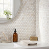 Calacatta gold penny-round mosaic marble tile with white circular pattern and subtle gray veining polished or honed finish