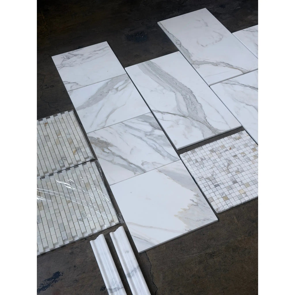 Calacatta Gold Stanza mosaic marble tile with white marble-effect and gray veining in showroom display