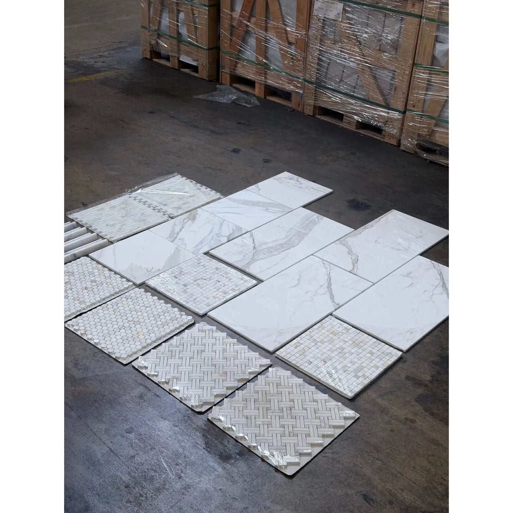 Calacatta Gold mosaic marble tile in polished hexagonal herringbone patterns